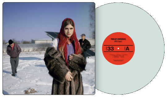 A pale solid-colour pressing with a printed centre label, half out of its
                    sleeve — the label artwork is the file that was uploaded for it.